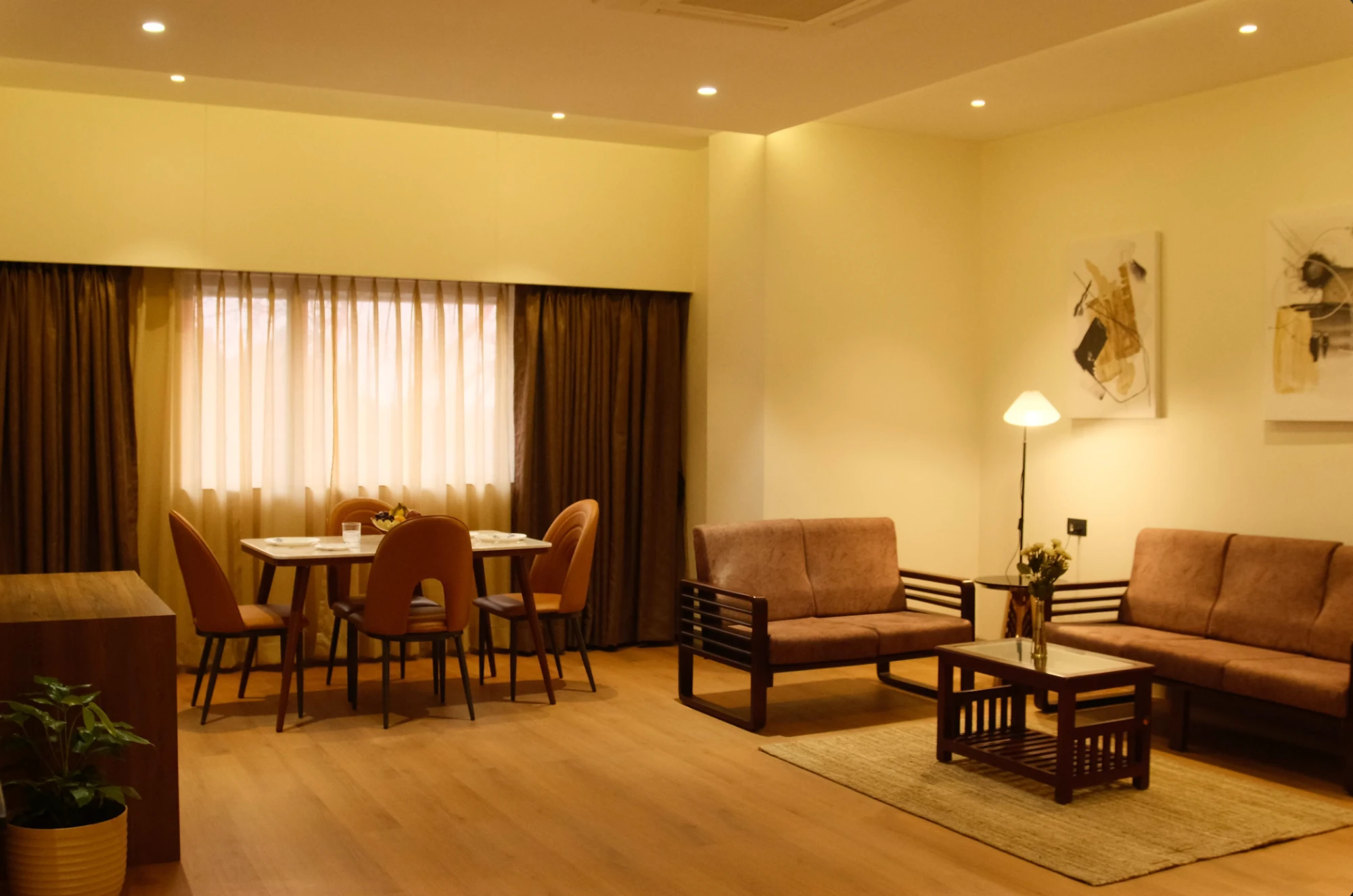 Suite living room with dining area and lounge seating